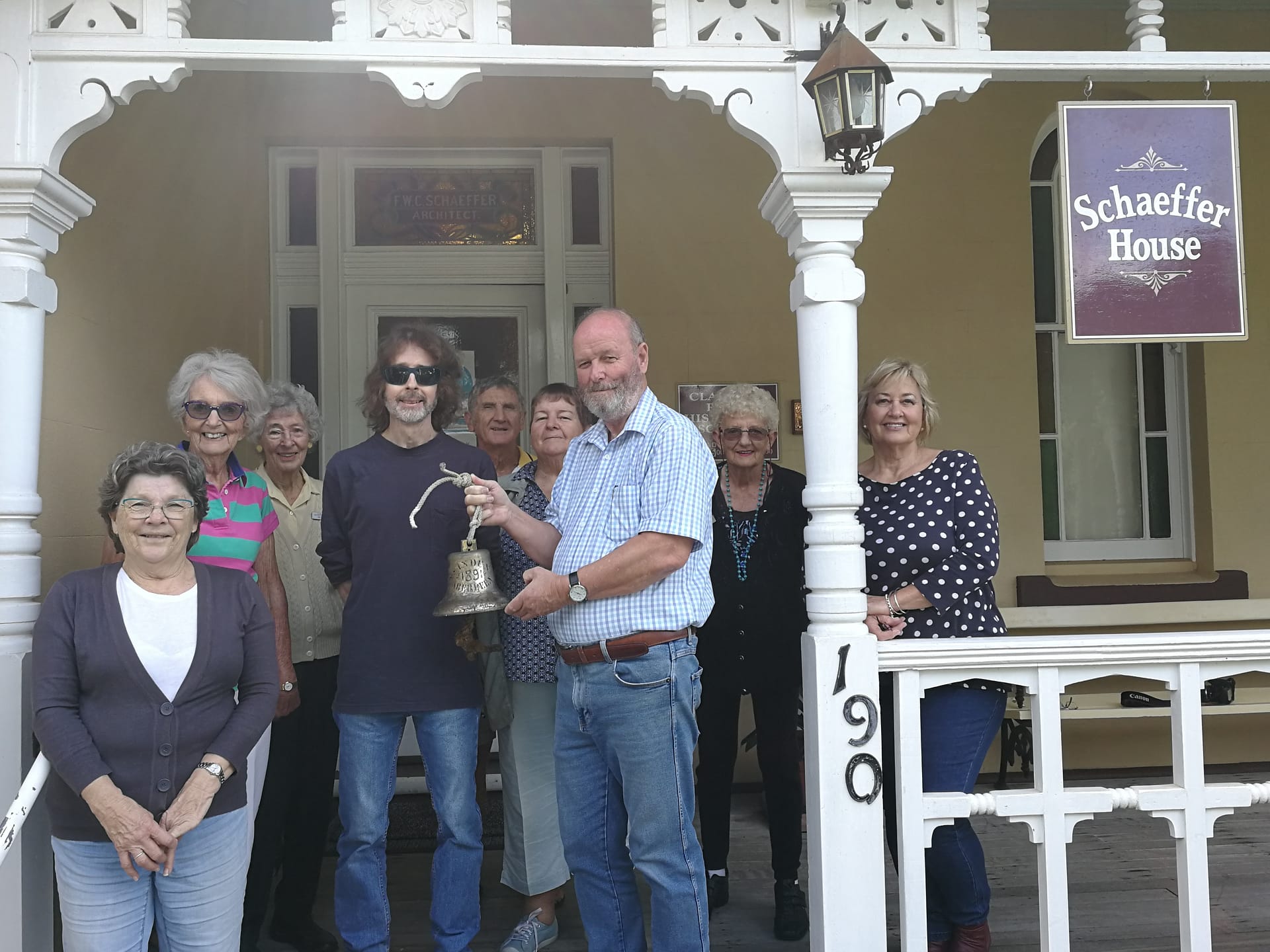 Historical society with SS Induna bell