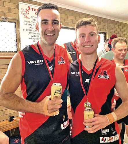 Bond. Ben and Bailey McNicholl celebrate winning the 2022 Yorke Peninsula Football League B grade premiership. The McNicholl family has been left devastated after discovering Bailey’s cochlear implant, which he has had for 17 years, could have been mapped incorrectly.
Photo: Yorke Peninsula Country Time