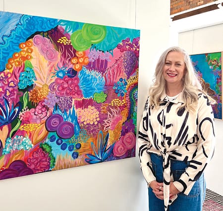 Michelle Kennedy and some of the work featured in her exhibition at Toowoomba’s Feather & Lawry Gallery. Photo: On Our Selection News