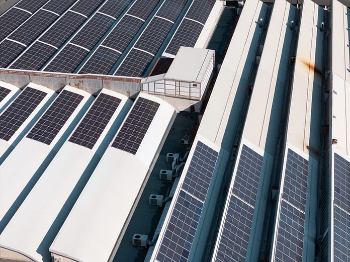 dreamstime_s_447524112 solar panels on warehouse rooves