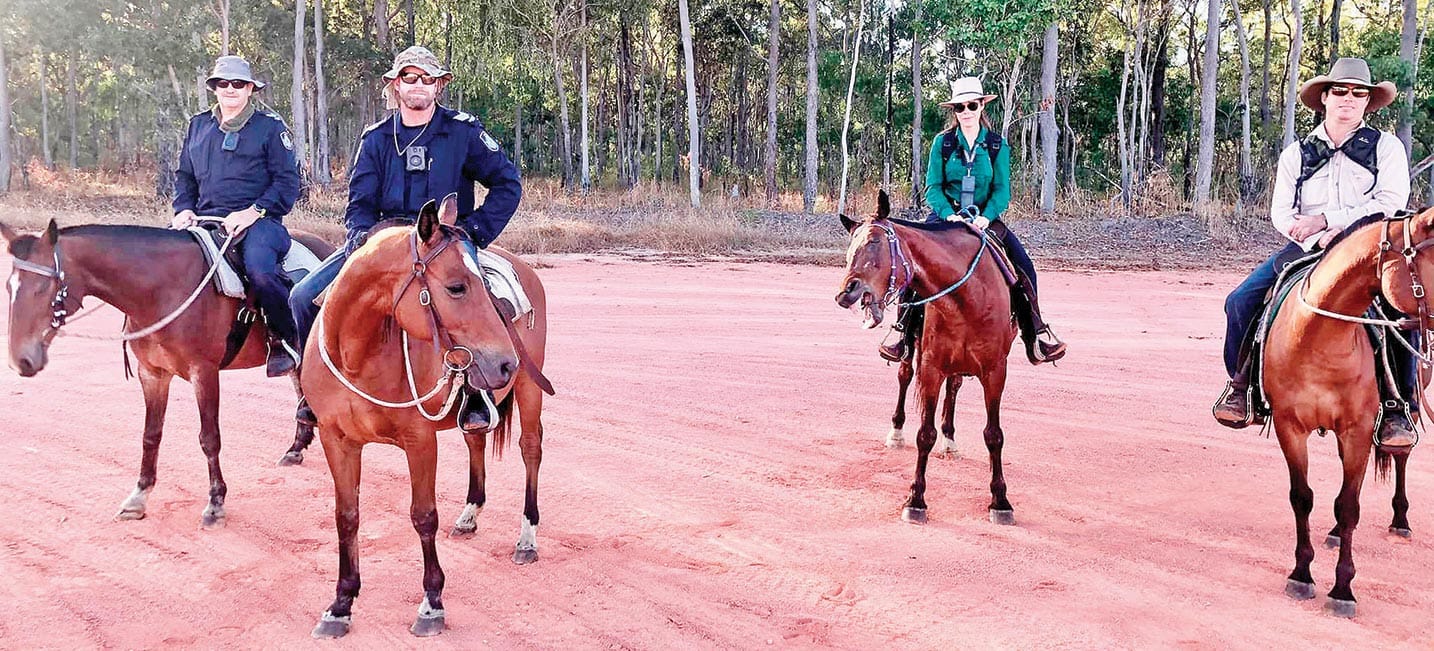 Watson River’s Luke Quartermaine, far right, brought in horses to help police with the search in the remote community.
