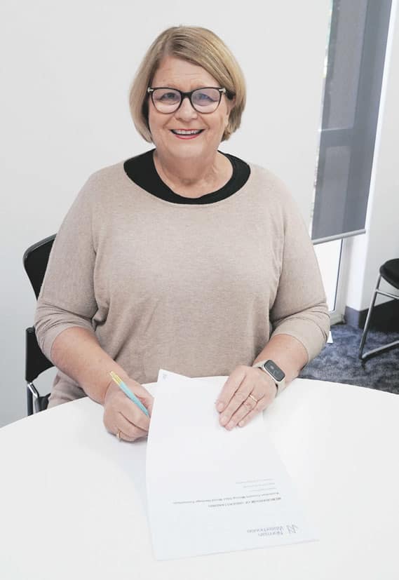 Small step. Copper Coast Council mayor Roslyn Talbot signs the Australian Cornish Mining Sites World Heritage Consortium Agreement, which will enable council to continue building its case for World Heritage Status for Moonta Mines. Photo: Yorke Peninsula Country Times