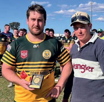 Wattles reserve grade back-rower Garth
Lonergan receiving the Peter Watt Memorial Medallion as Best & Fairest Player against Warwick on Sunday from Mr Nathan Watt. (Photo Amanda O'Halloran). Photo: Allora Advertiser