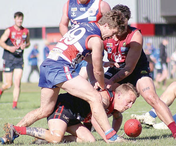 Corryong’s Tom Saunders comes under pressure. Photo: Deb Harrap