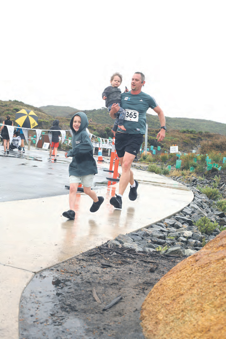 Ken Willis gets some family help at the fi nish.